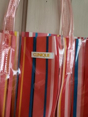 Clinique Transparent Pink-Handled Tote with Red and Multicolor Stripes